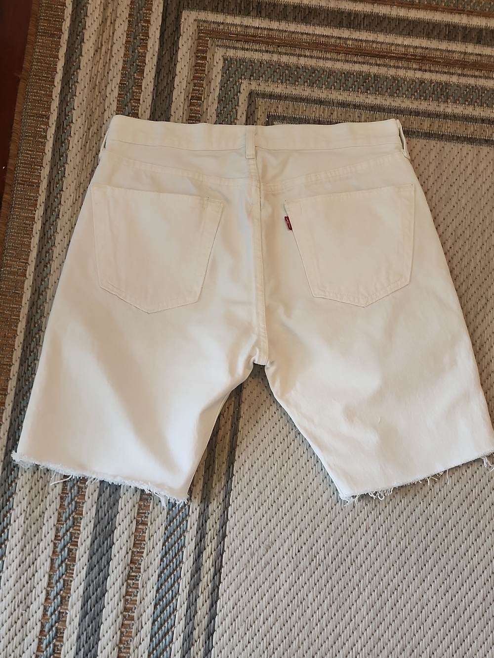 Levi's White Denim Women's Cutoff Shorts with Frayed Hem and Red Tab